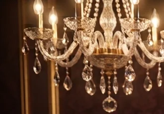 the chandelier over table seven, the only thing here older than the debt